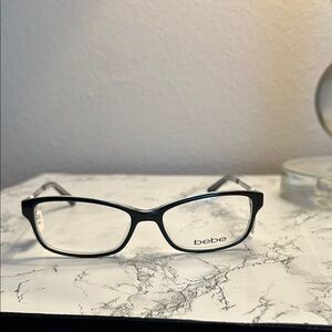 Bebe Classic Black and Gold accents Glasses for Women. Size 53-16-135